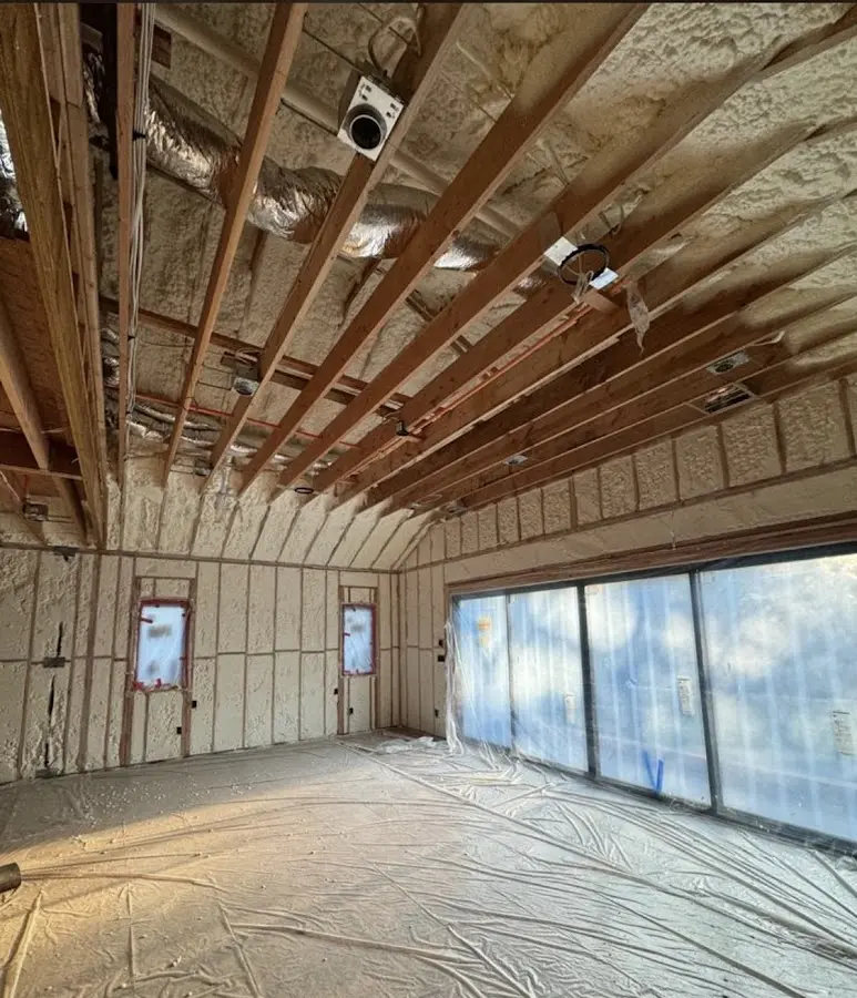 Interior walls and ceiling insulated with spray foam during new construction in Clarkson